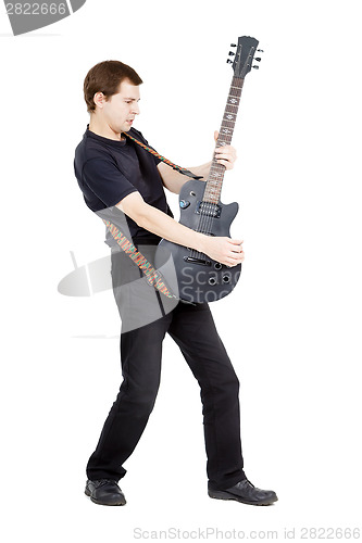 Image of Man on a white background. Performer with an electric guitar