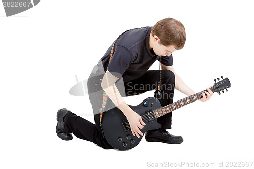 Image of Man on a white background. Performer with an electric guitar