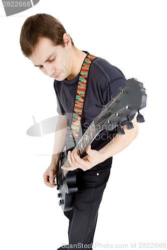 Image of Man on a white background. Performer with an electric guitar