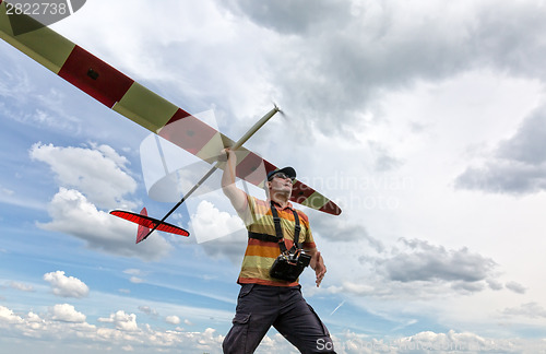 Image of Man launches into the sky RC glider