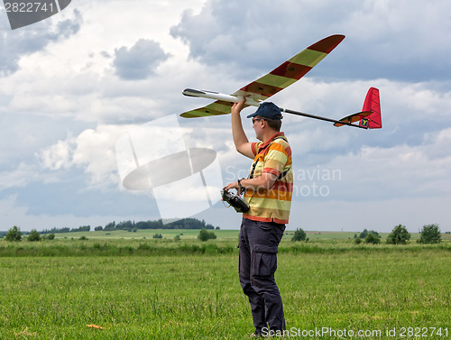 Image of Man launches into the sky RC glider