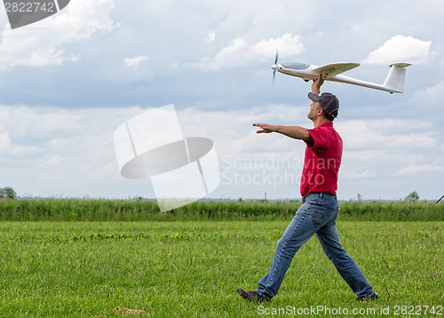 Image of Man launches into the sky RC glider