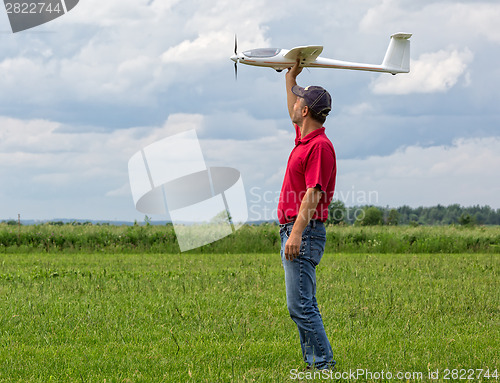 Image of Man launches into the sky RC glider