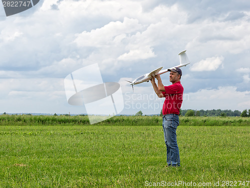 Image of Man launches into the sky RC glider