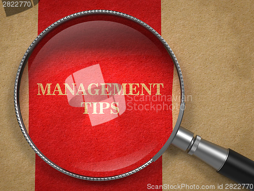 Image of Management Tips Magnifying Glass on Old Paper.