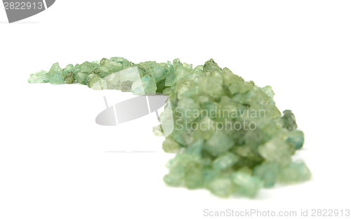 Image of Green granulate for bathing arranged arched on white background