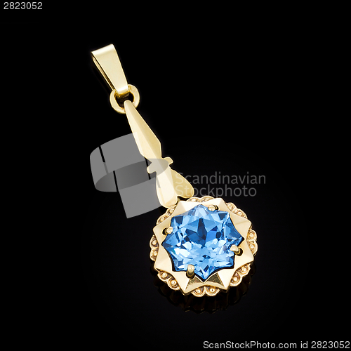 Image of Gold pendant with blue stone