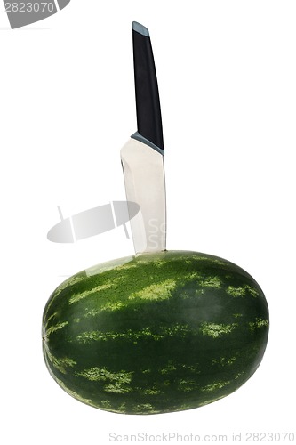Image of Fresh watermelon with kitchen knife isolated over white background