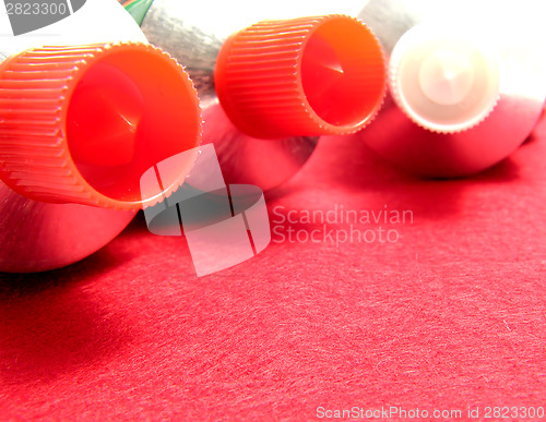 Image of Three sealed tubes on a red placemat