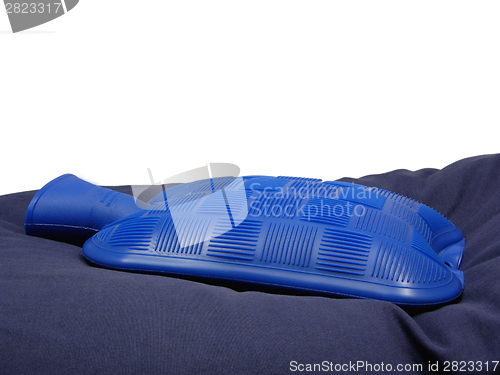 Image of Blue hot-water bag on a blue pillow