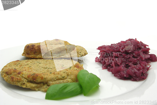 Image of Round flat potato dough cakes with basil and red cabbage