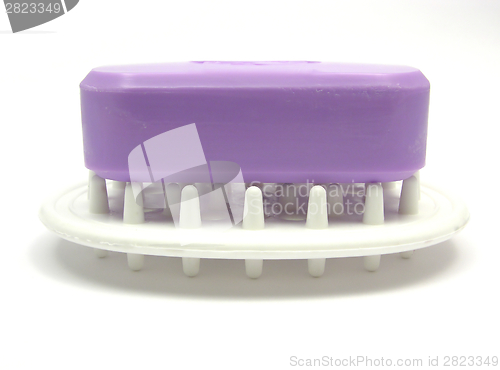 Image of Lilac soap on a soap dish on a white background