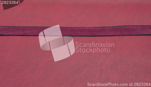 Image of Puple band on a red leatherette