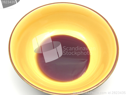 Image of One bowl of ceramic with  pumpkin seed oil on white