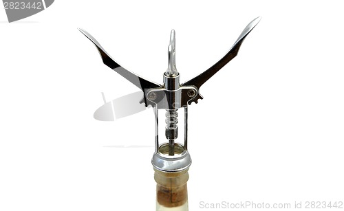 Image of White wine and corkscrew