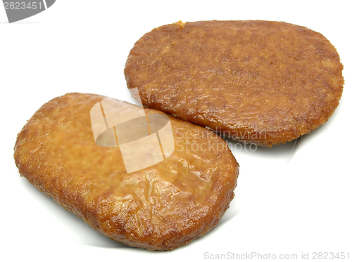 Image of Two breaded bean curd cutlets on a white plate