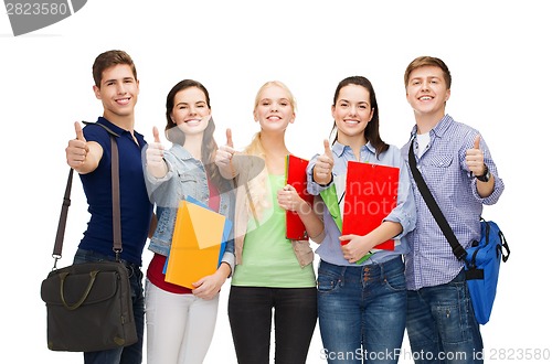 Image of group of smiling students showing thumbs up