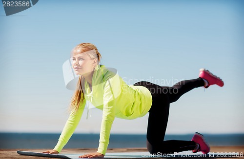 Image of woman doing sports outdoors
