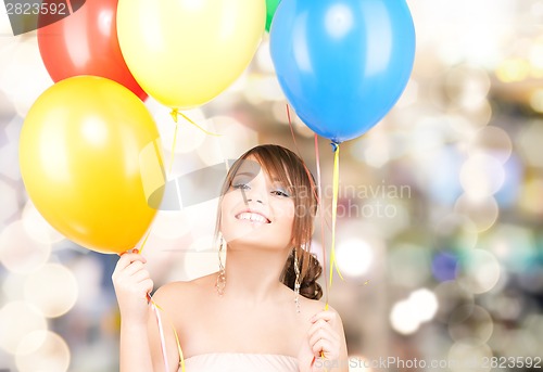 Image of happy teenage girl with balloons