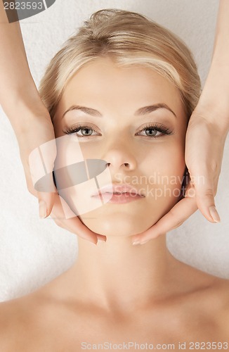 Image of beautiful woman in massage salon