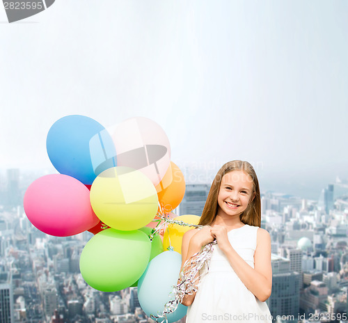 Image of happy girl with colorful balloons