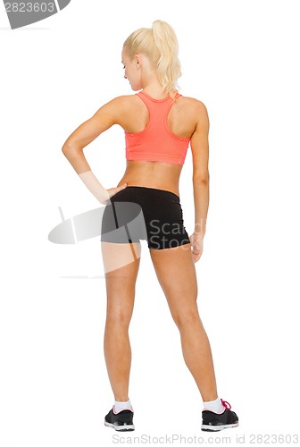 Image of athletic woman in sportswear from the back