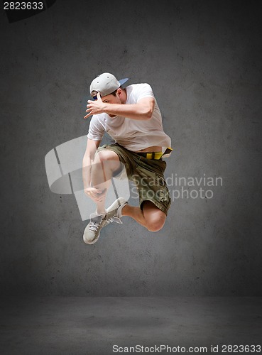 Image of male dancer jumping in the air