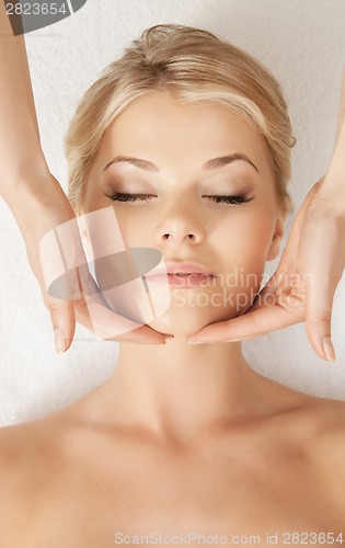 Image of beautiful woman in massage salon