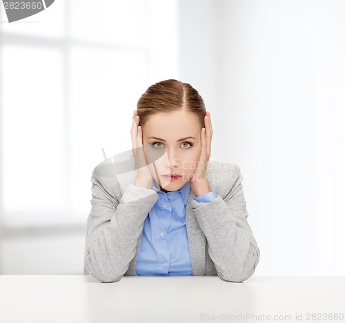 Image of stressed businesswoman