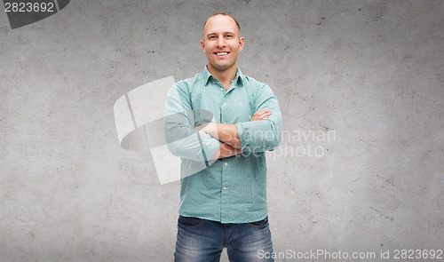 Image of smiling man with crossed arms