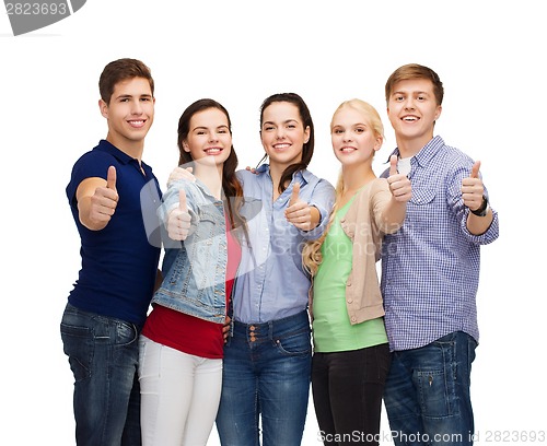 Image of group of smiling students showing thumbs up