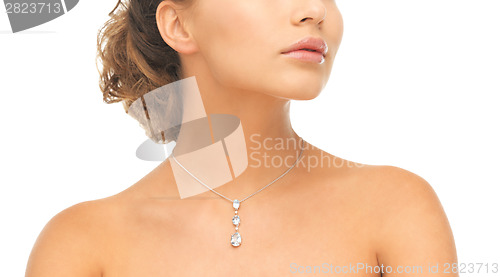 Image of woman wearing shiny diamond necklace