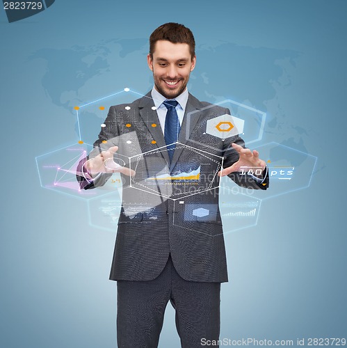 Image of businessman working with virtual screen