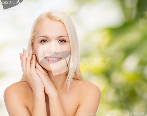 Image of face and hands of happy woman