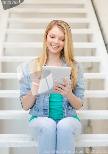 Image of smiling female student with tablet pc computer