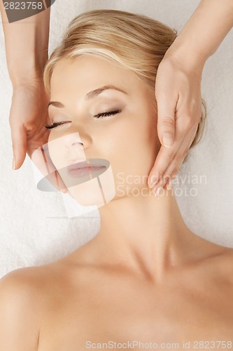 Image of beautiful woman in massage salon