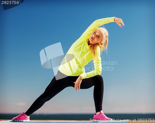 Image of woman doing sports outdoors