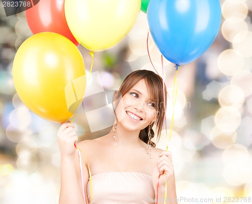 Image of happy teenage girl with balloons