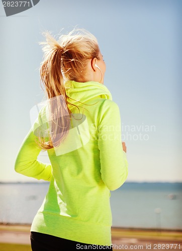 Image of woman doing running outdoors
