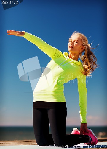 Image of woman doing sports outdoors