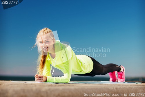 Image of woman doing sports outdoors