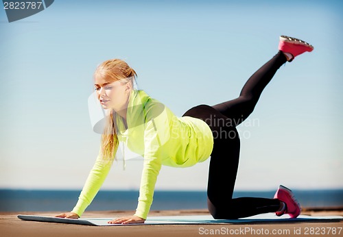 Image of woman doing sports outdoors