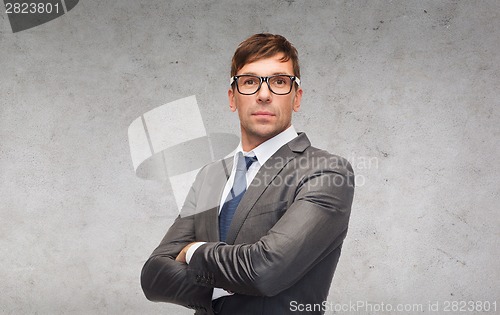 Image of attractive businessman or teacher in glasses