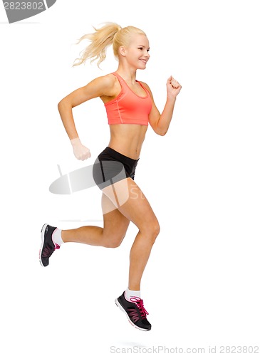 Image of sporty woman running or jumping