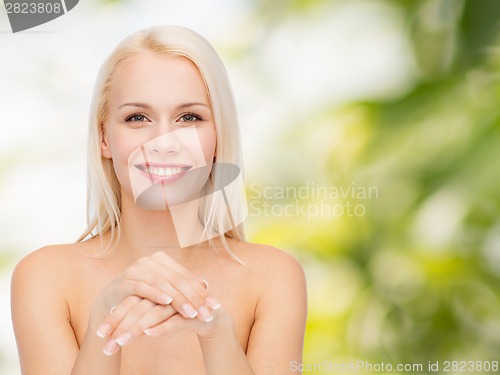 Image of face and hands of beautiful woman