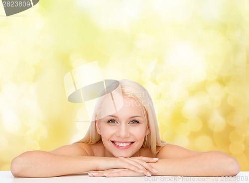 Image of clean face and shoulders of beautiful young woman