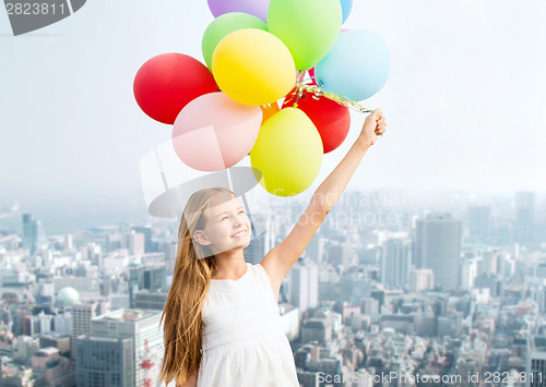 Image of happy girl with colorful balloons