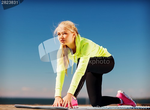 Image of woman doing sports outdoors