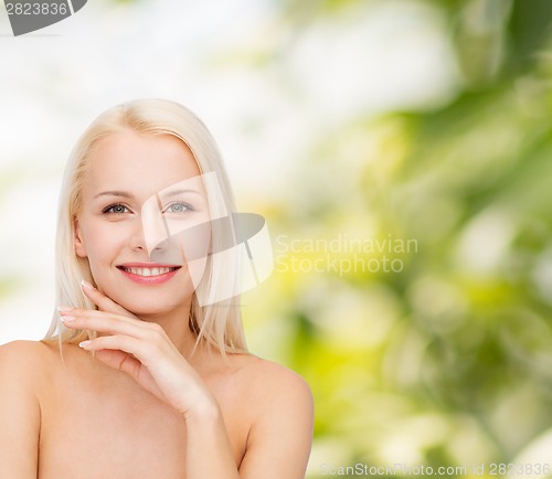 Image of face and hands of beautiful woman