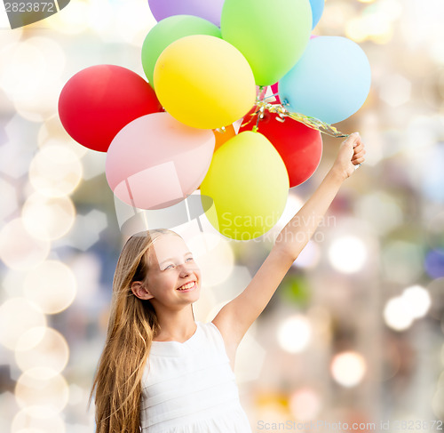 Image of happy girl with colorful balloons